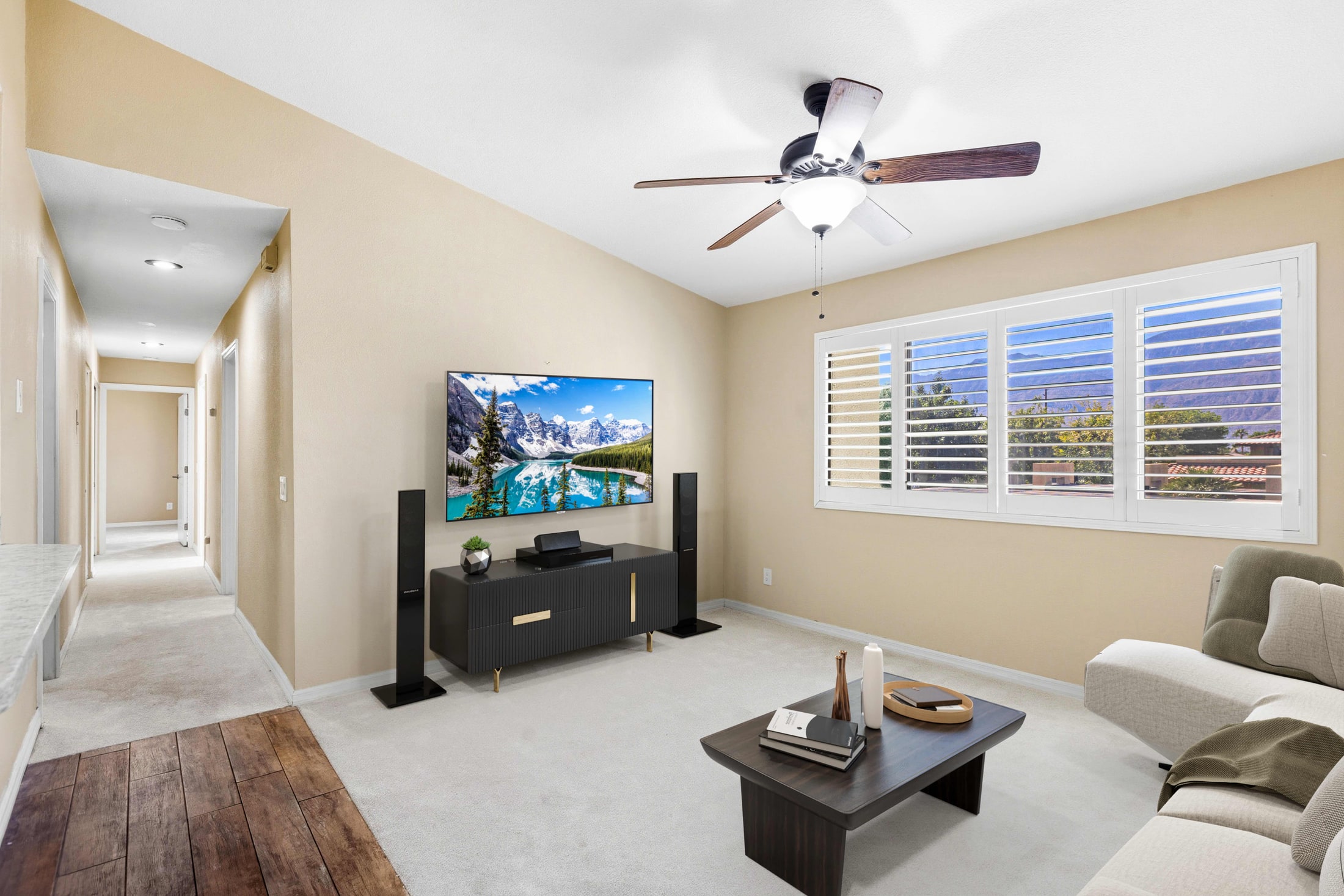 A bonus room that was completely empty in the original frame, furnished as a media room.