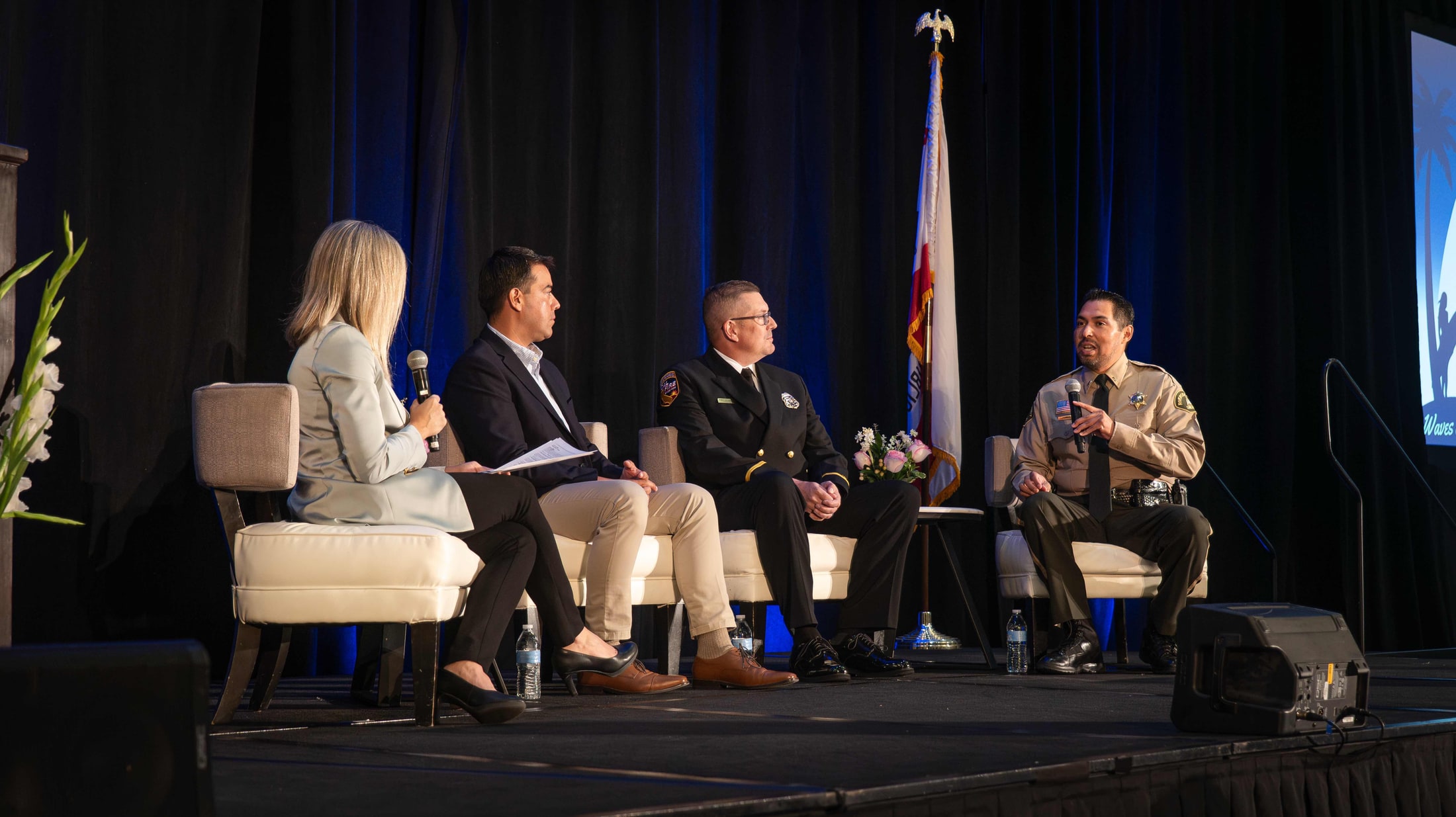Panel discussion on stage at a community event