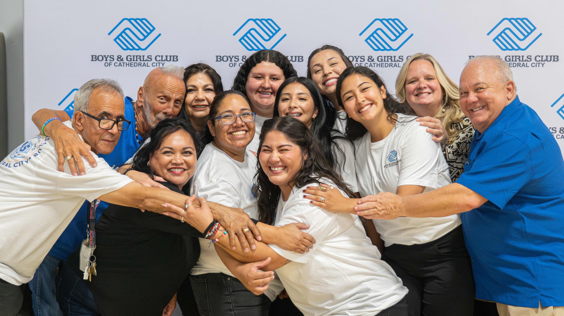 Group hug at a community nonprofit event