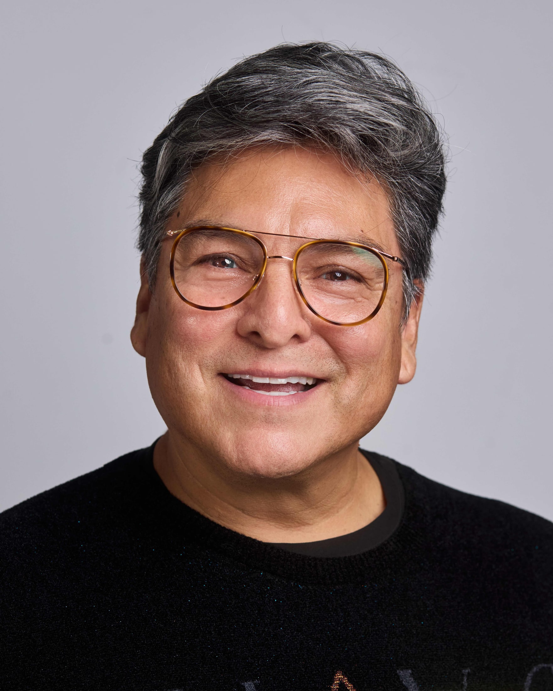 Business headshot photographed with soft studio lighting