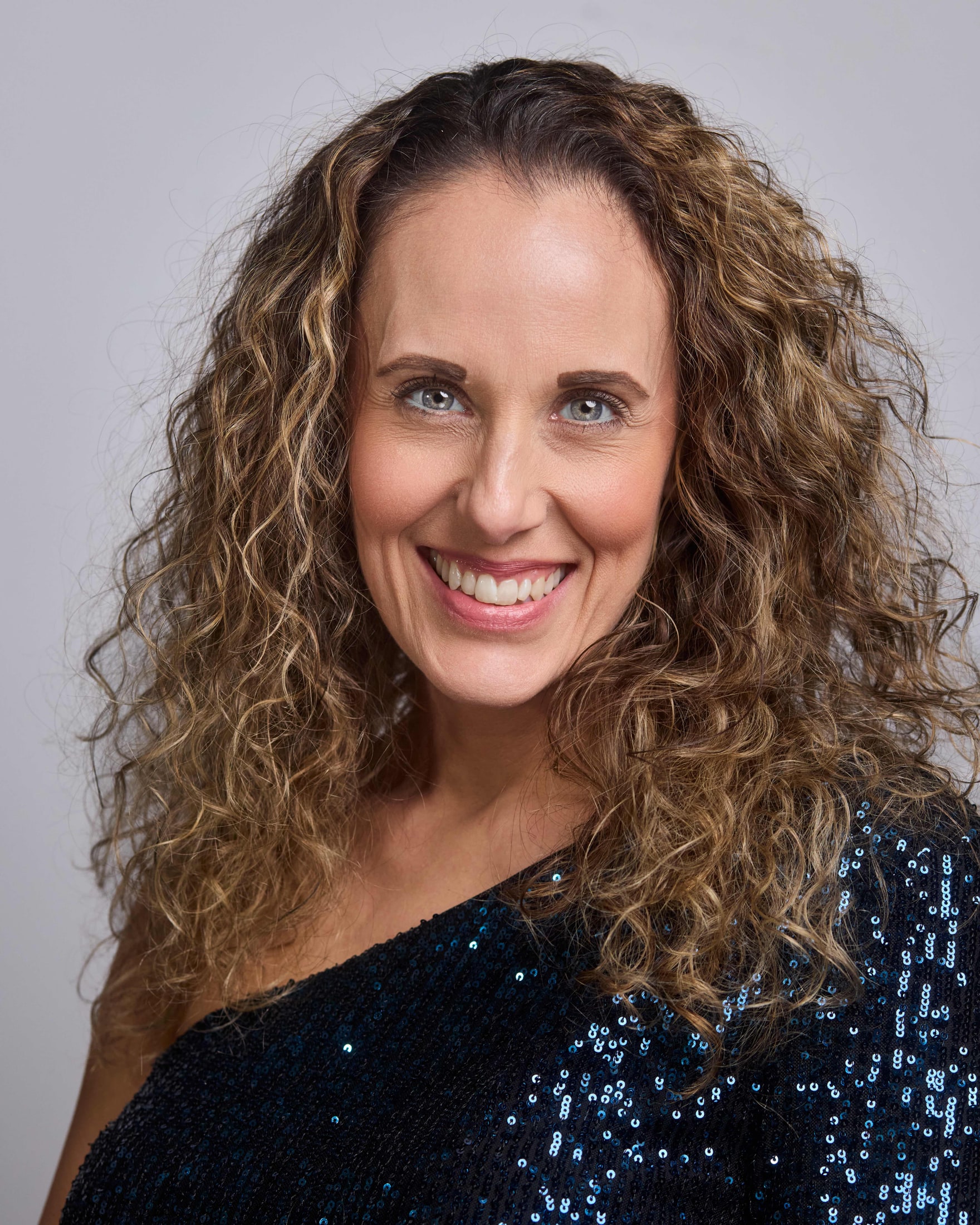 Team headshot portrait against a seamless backdrop