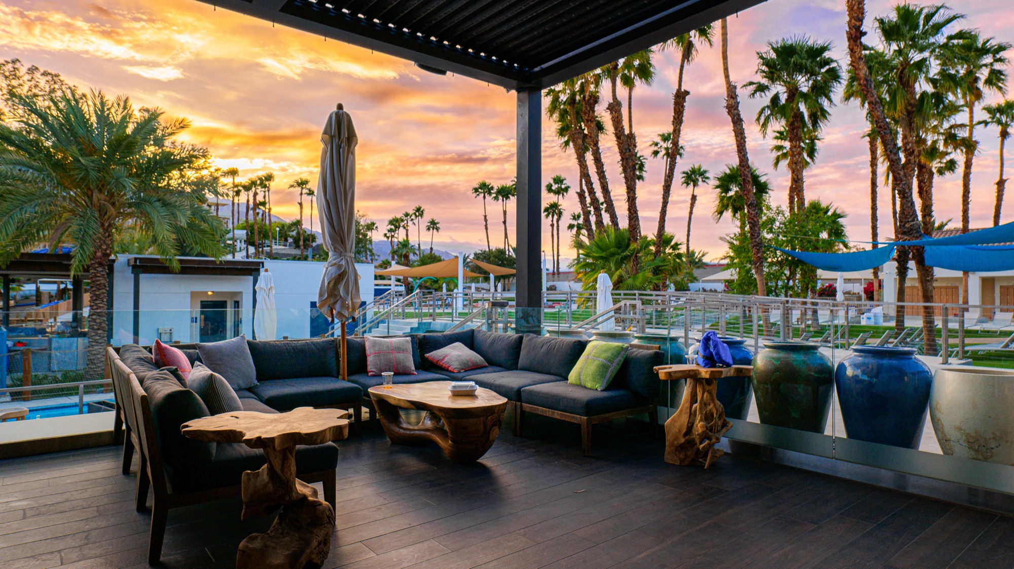 Desert lounge patio under a colorful sunset sky