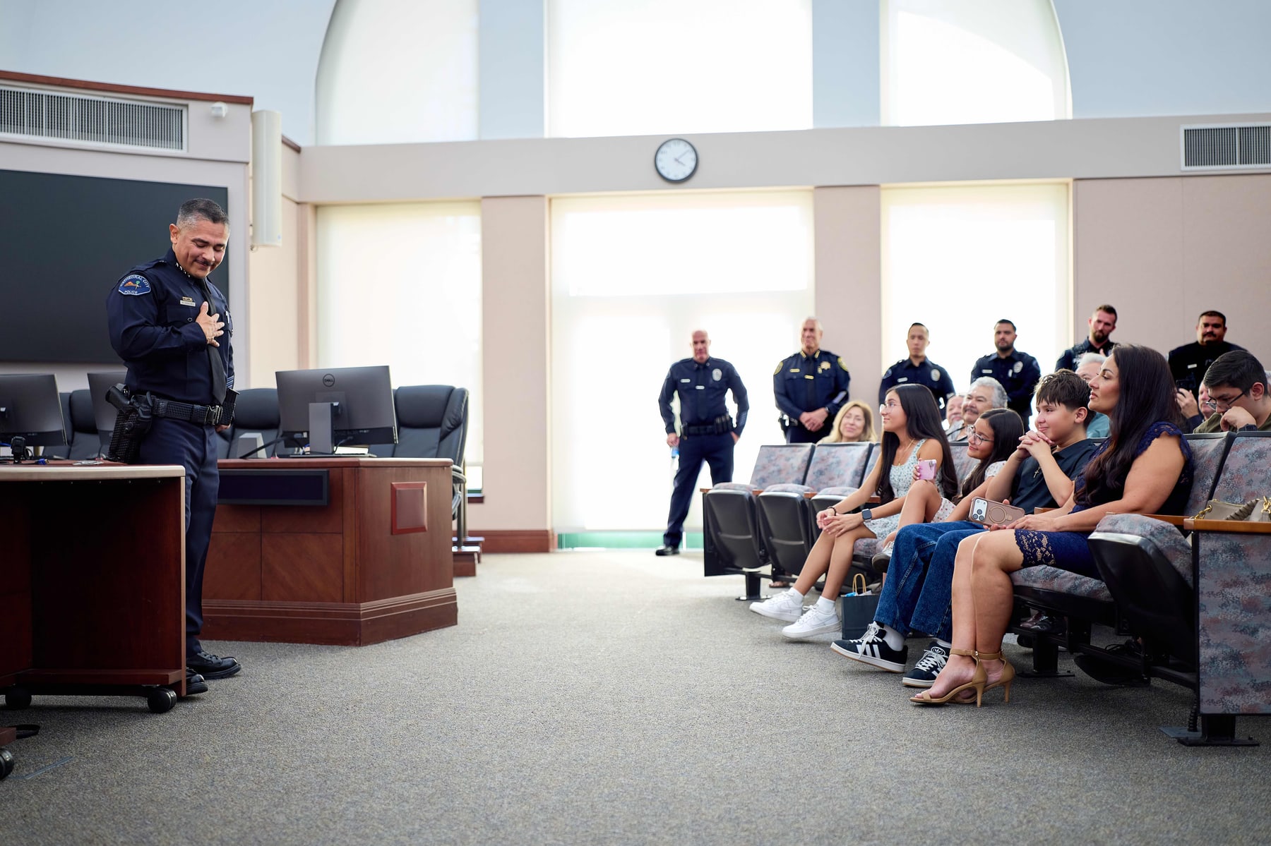 Family and officers gathered in the council chamber