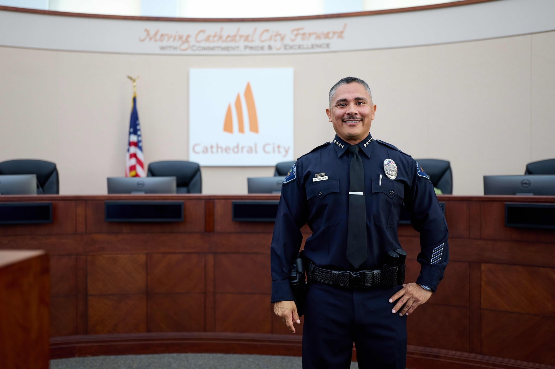 An officer photographed in front of the Cathedral City dais