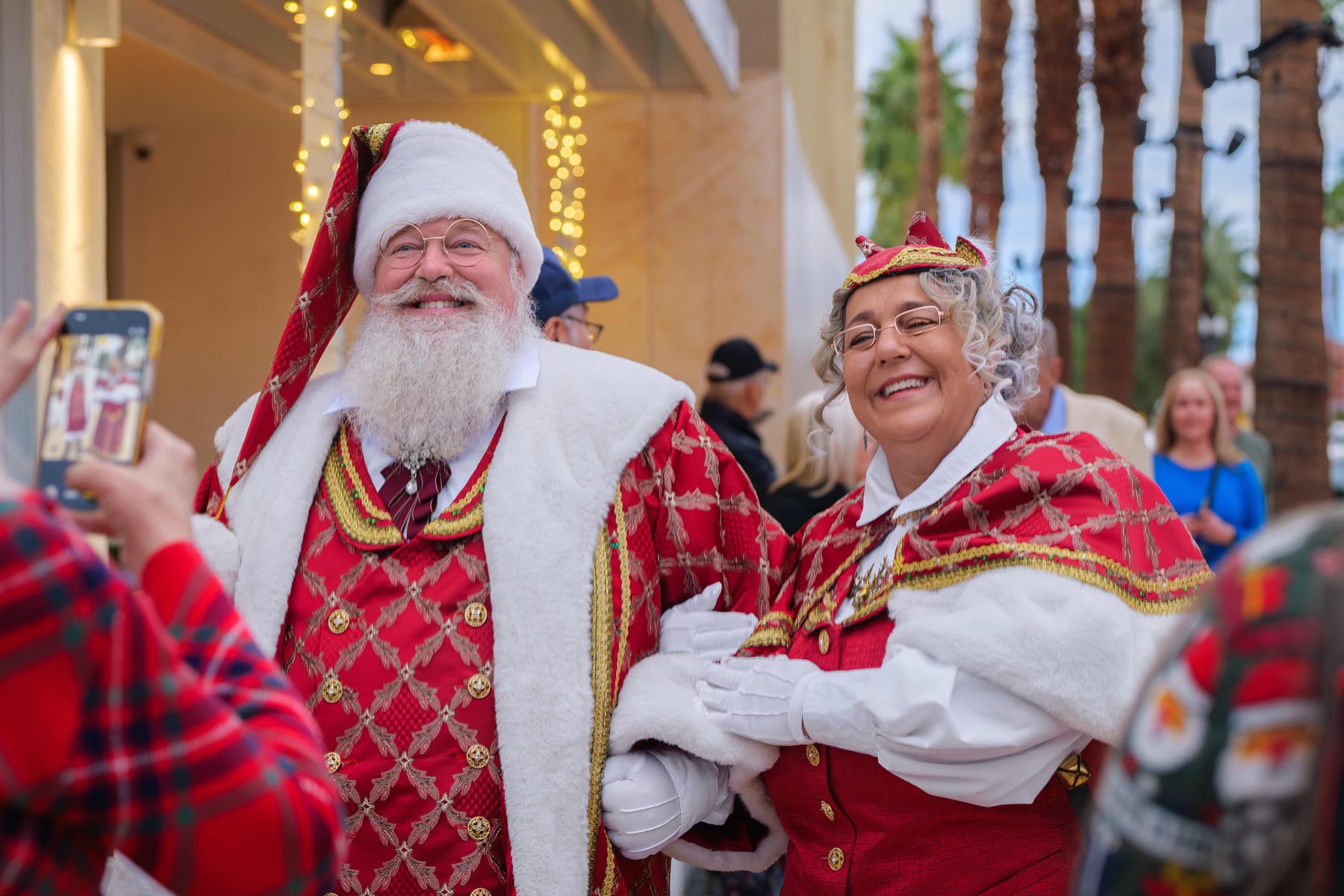 Santa and Mrs Claus greeting guests at the tree lighting