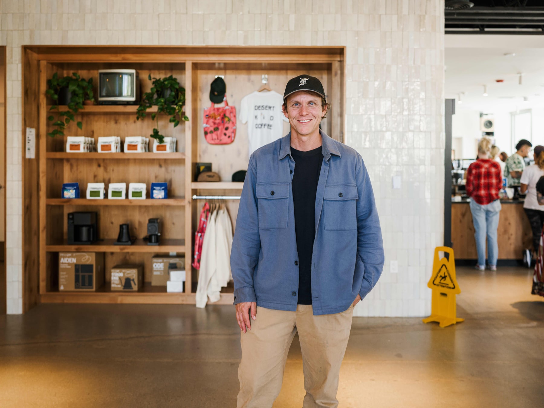 A member of the Desert Kids Coffee team in the new shop