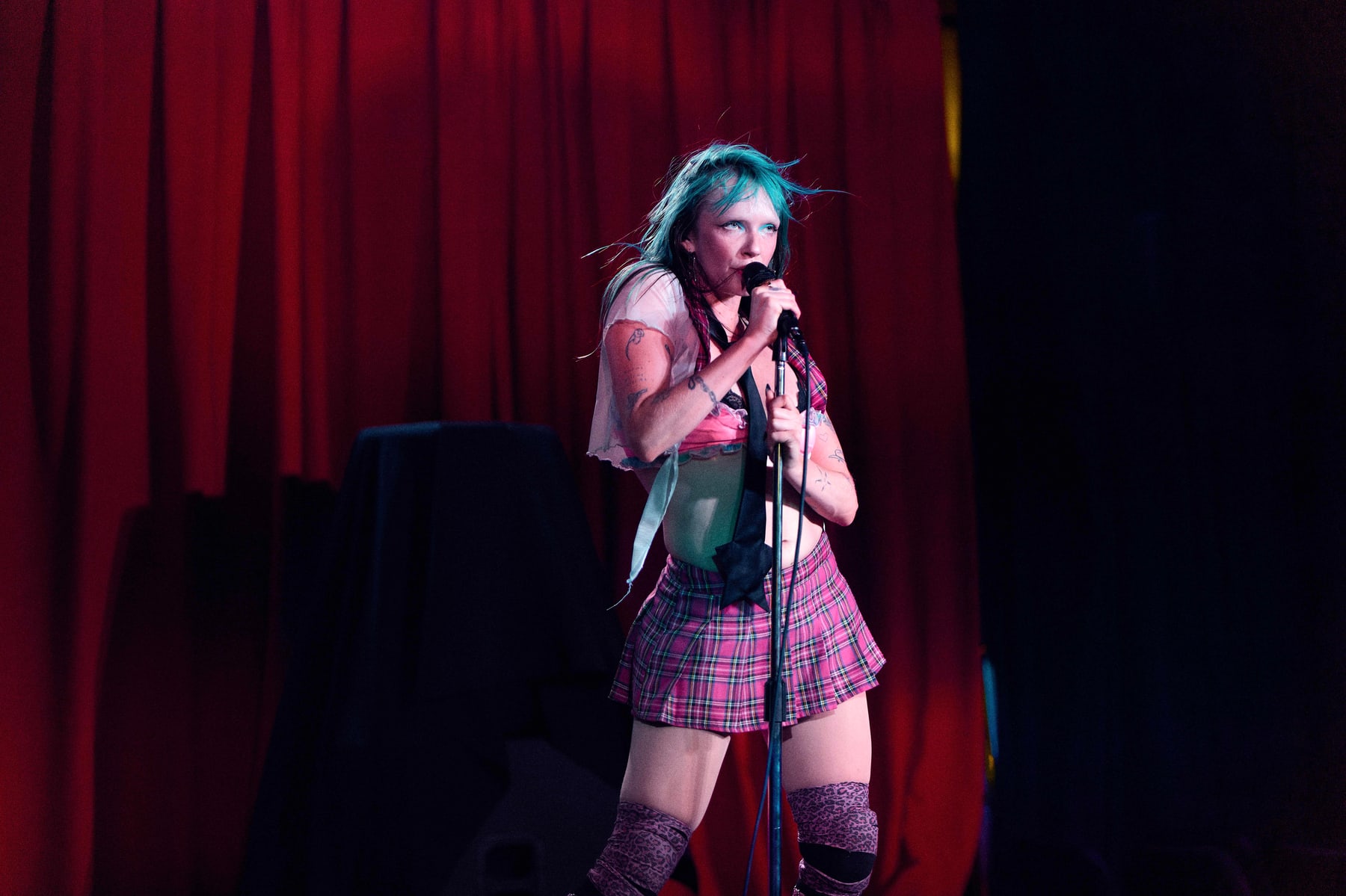 Tender Misfit singing under the stage lights