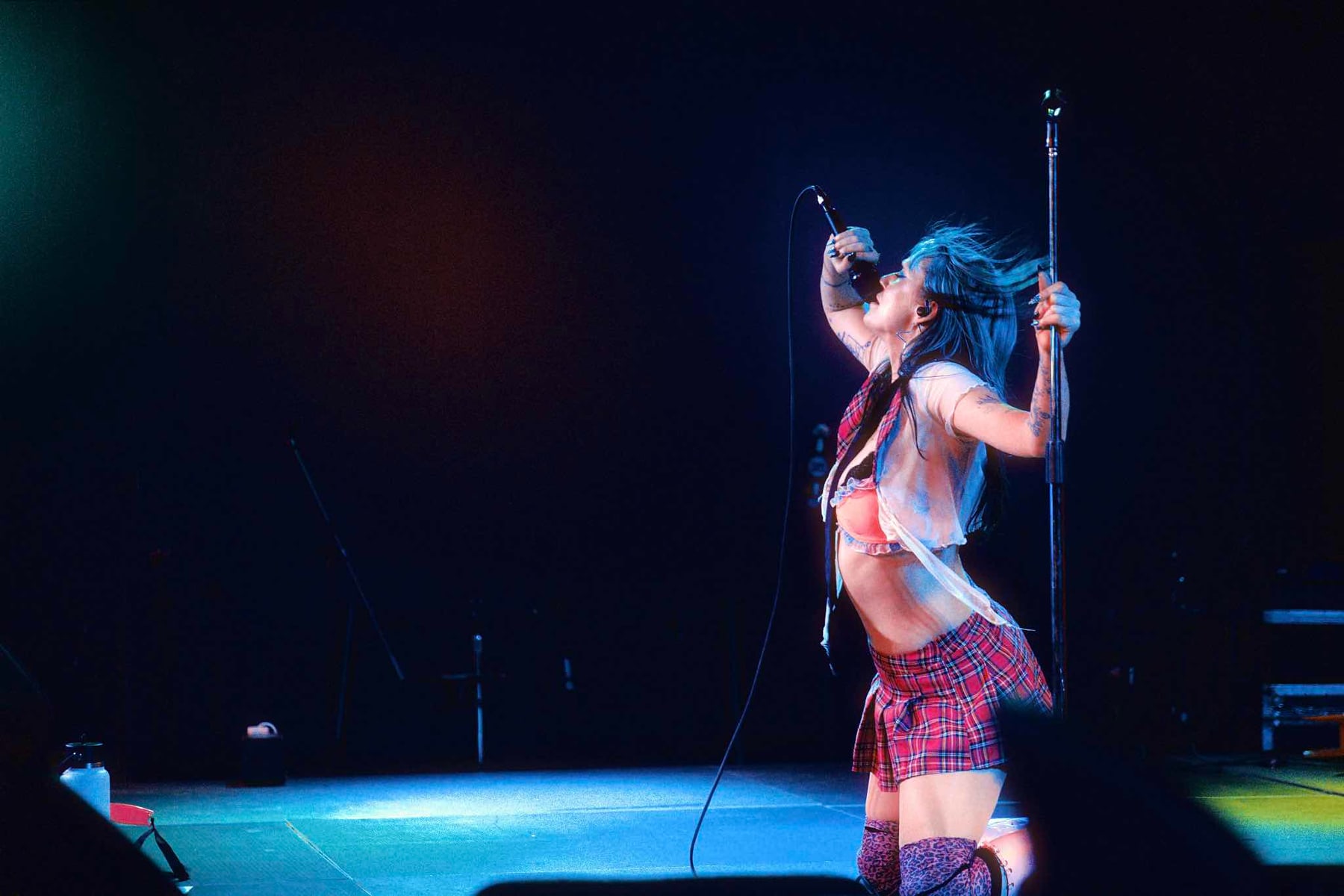 Tender Misfit on a blue lit stage