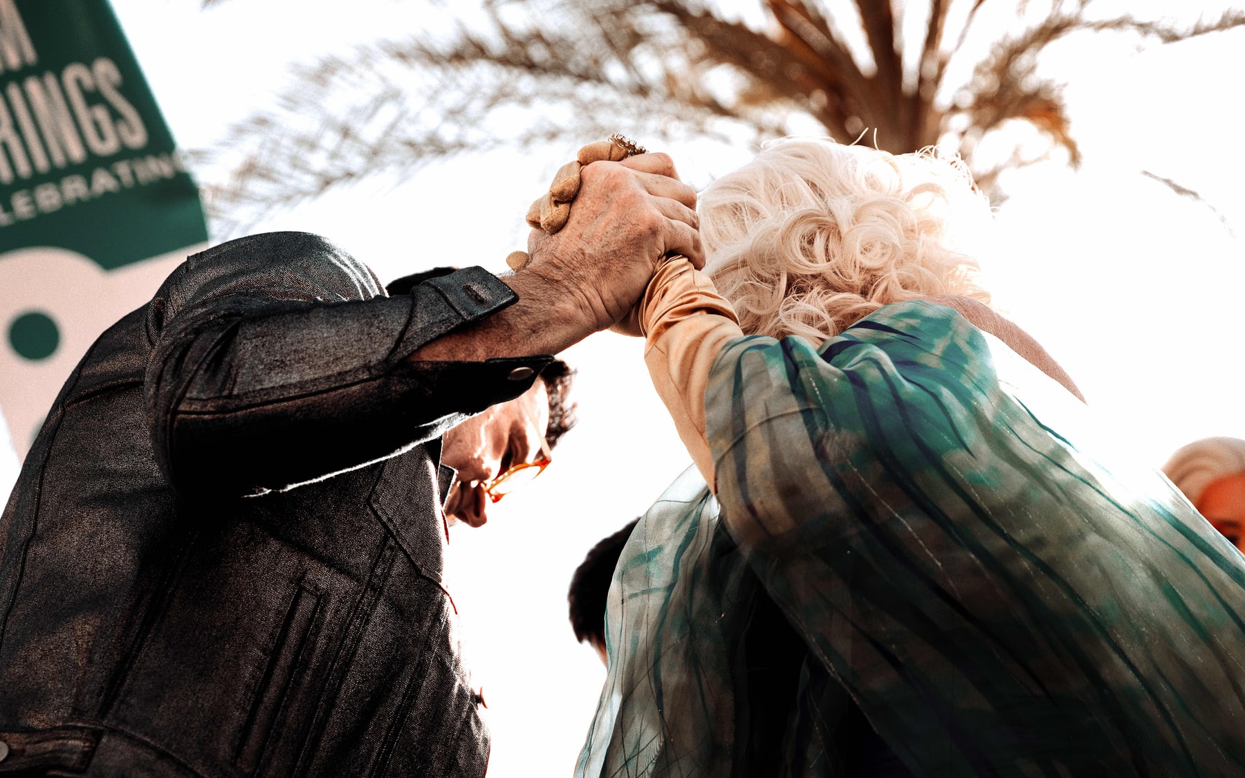 Two people holding each other at a community protest