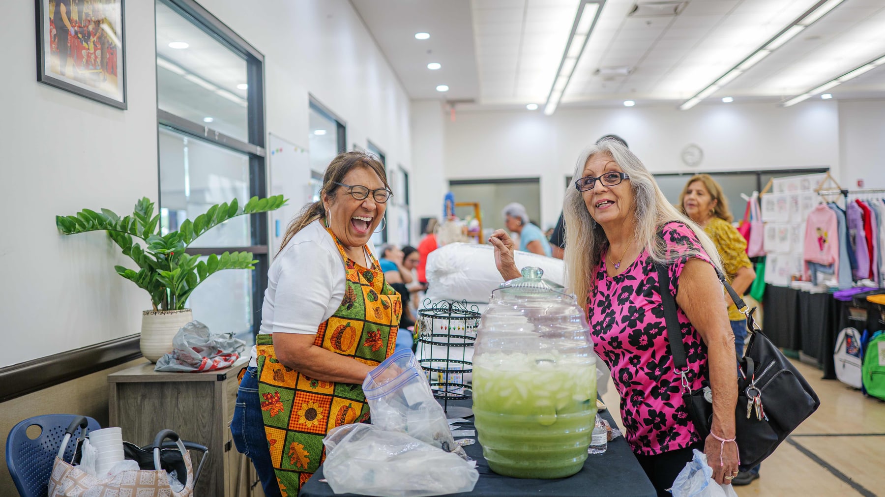 Attendees browsing the tables at the senior health and craft fair