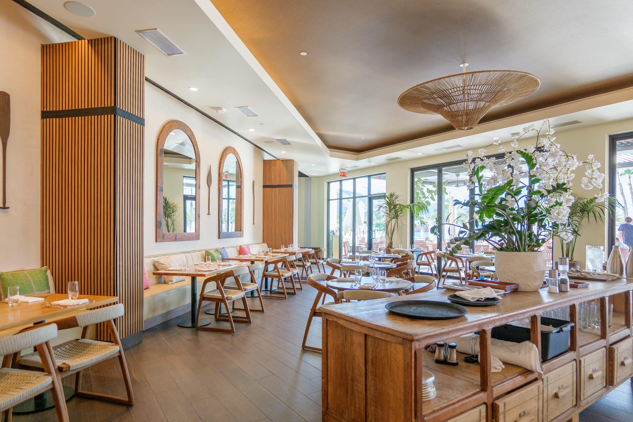 Resort dining room with wood ceiling and arched mirrors, Rancho Mirage