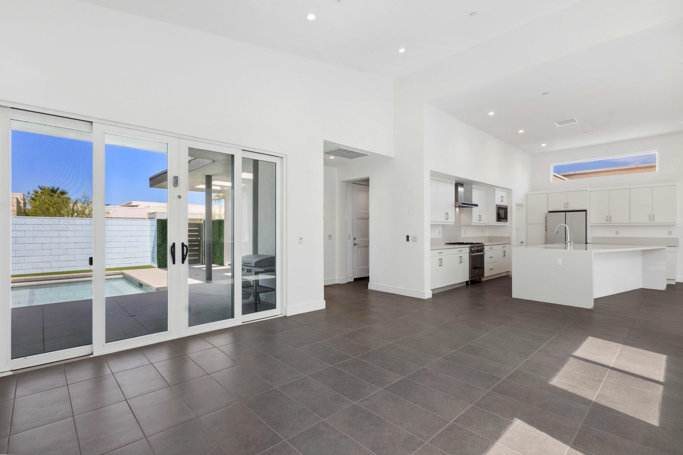 Open plan living and kitchen with sliding doors onto the patio