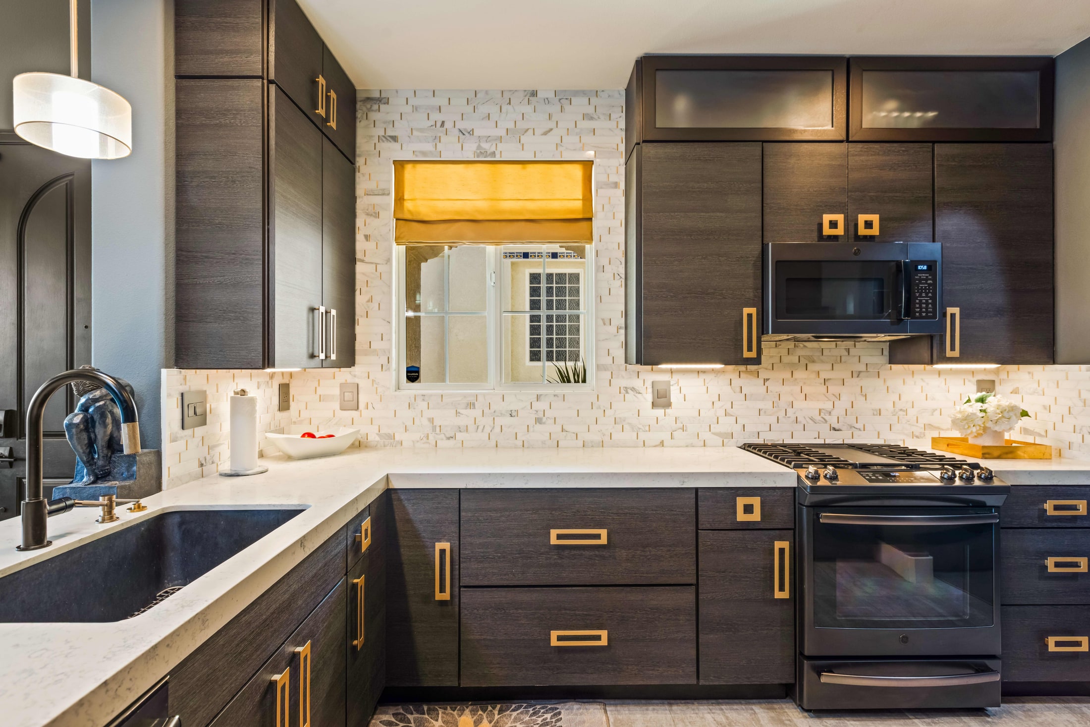 A kitchen cleared back to bare counter. Nothing out except what belongs there.