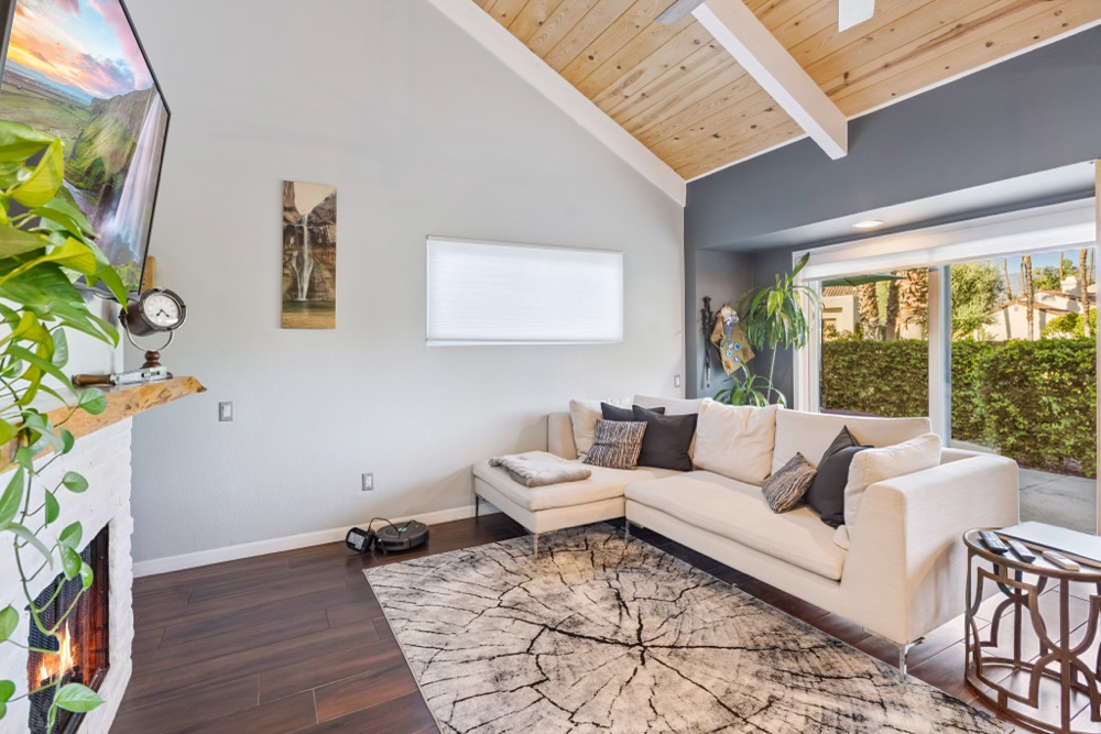 Living room with vaulted wood ceiling